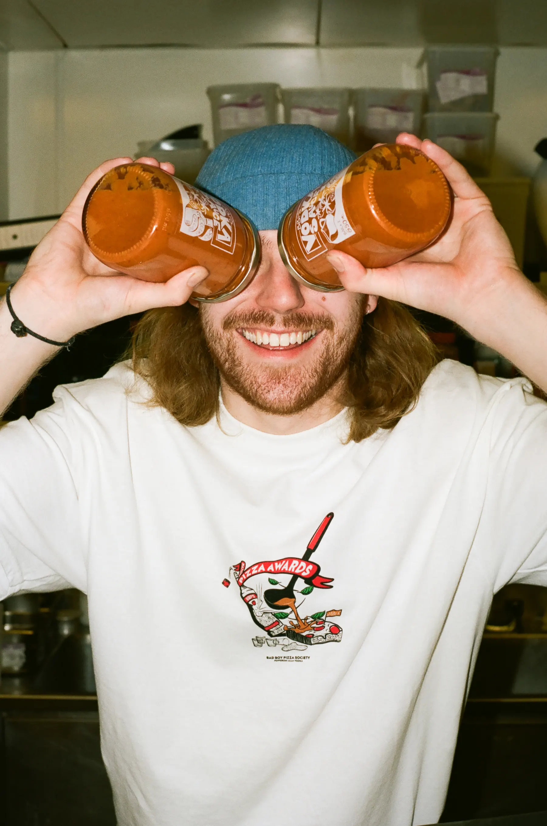A maker holding their jars